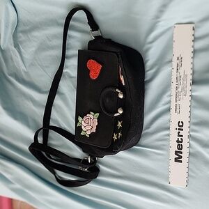 Crossbody black purse with embroidered patches